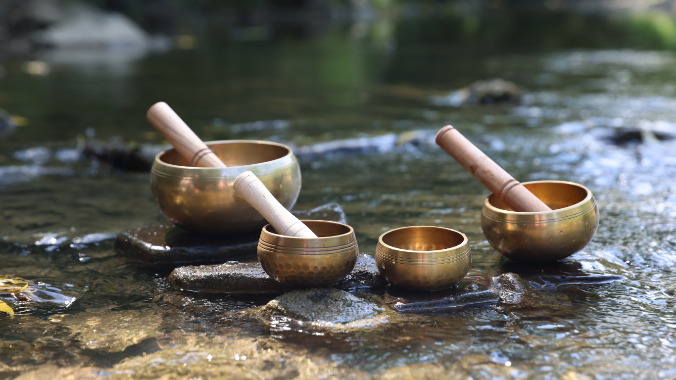 Tibetan and crystal singing bowls arranged for a sound healing session in Saddle River, NJ