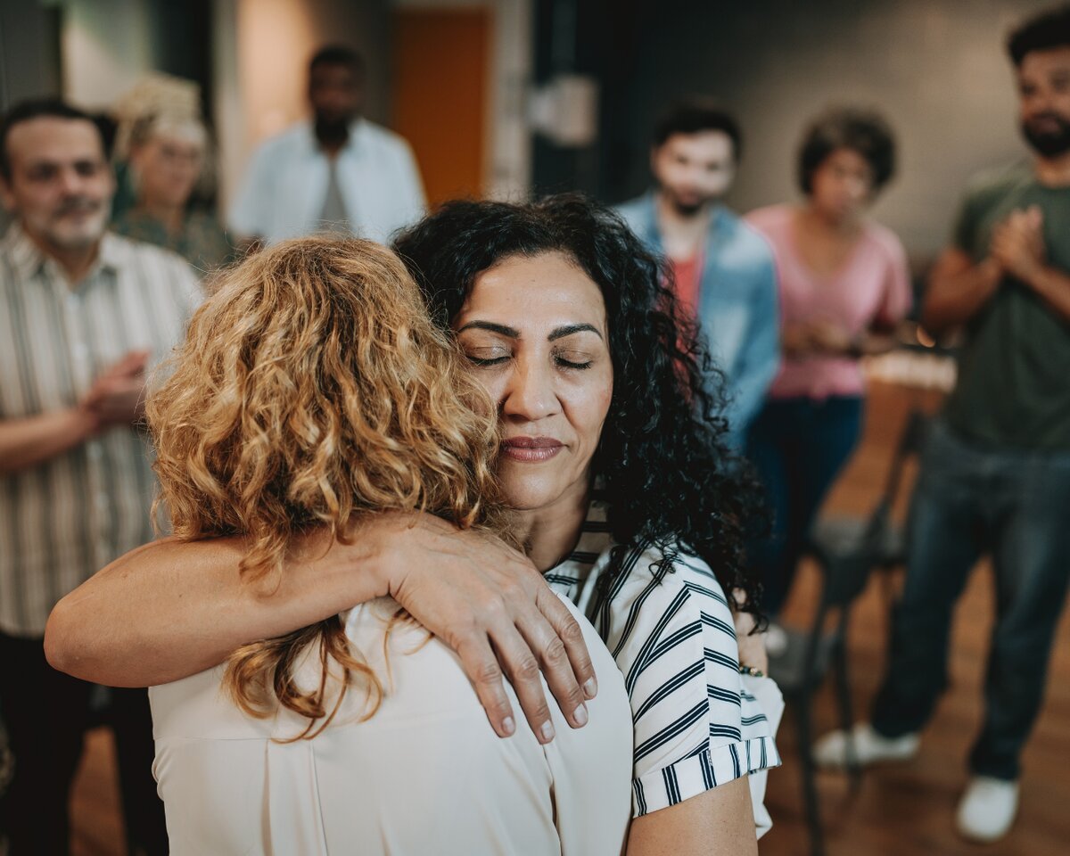 Small grief support group circle meeting in Bergen County NJ with compassionate facilitator